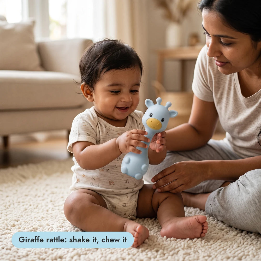 Baby with the giraffe teething rattle from the Big Bite Set
