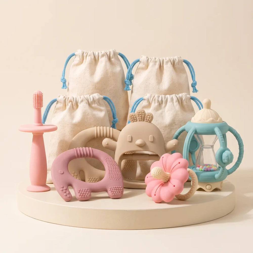 Complete Teething Gift Box teethers together on a cream stand