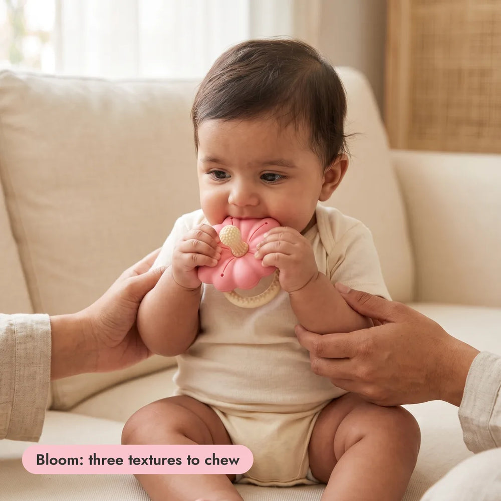 Baby with the Bloom Teether from the Complete Teething Gift Box