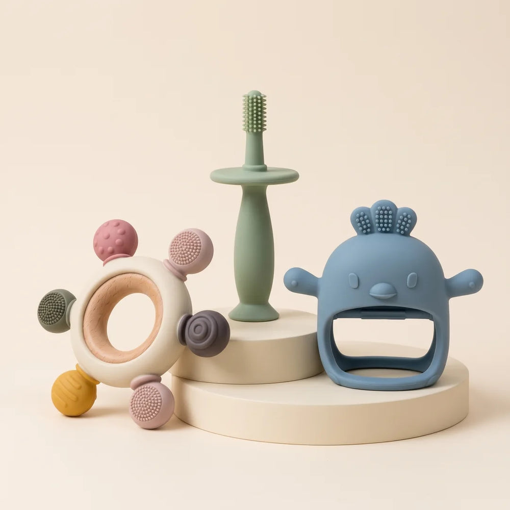 Gentle Start Trio teethers together on a cream stand
