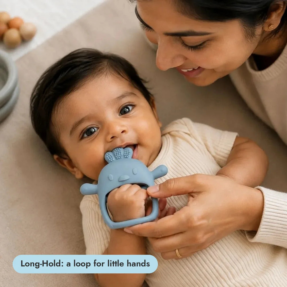 Baby with the Long-Hold Handle Teether from the Gentle Start Trio