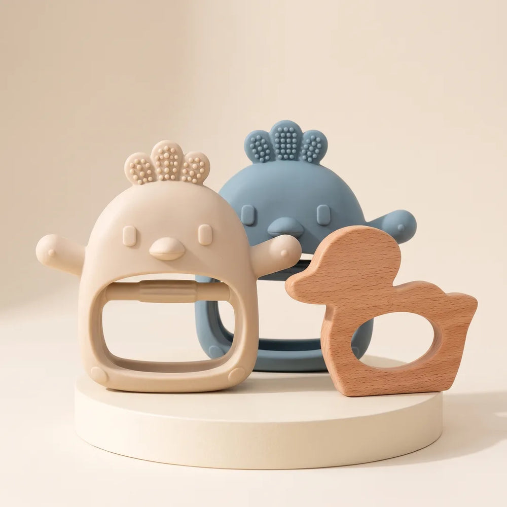 Long-Hold Twin Pack + Wooden teethers together on a cream stand