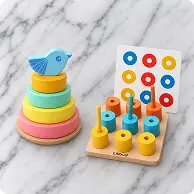 Wooden rainbow stacker with bird and a colour peg sorting board